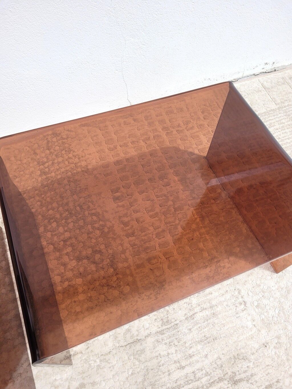 Pair of vintage smoked plexiglass nesting tables.