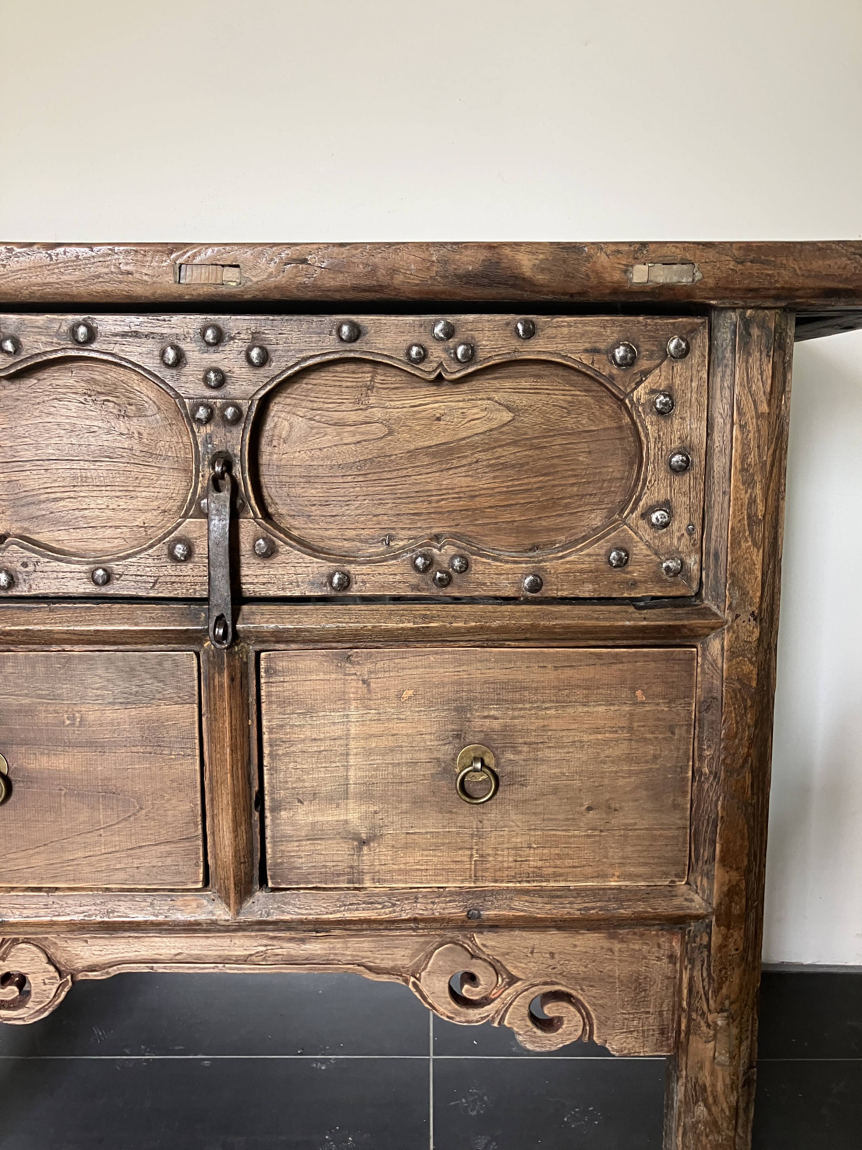 Very old elm wood with carved patterns and ironwork pieces.