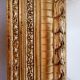 Large gilded wood and stucco mirror with foliage