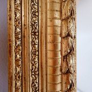 Large gilded wood and stucco mirror with foliage