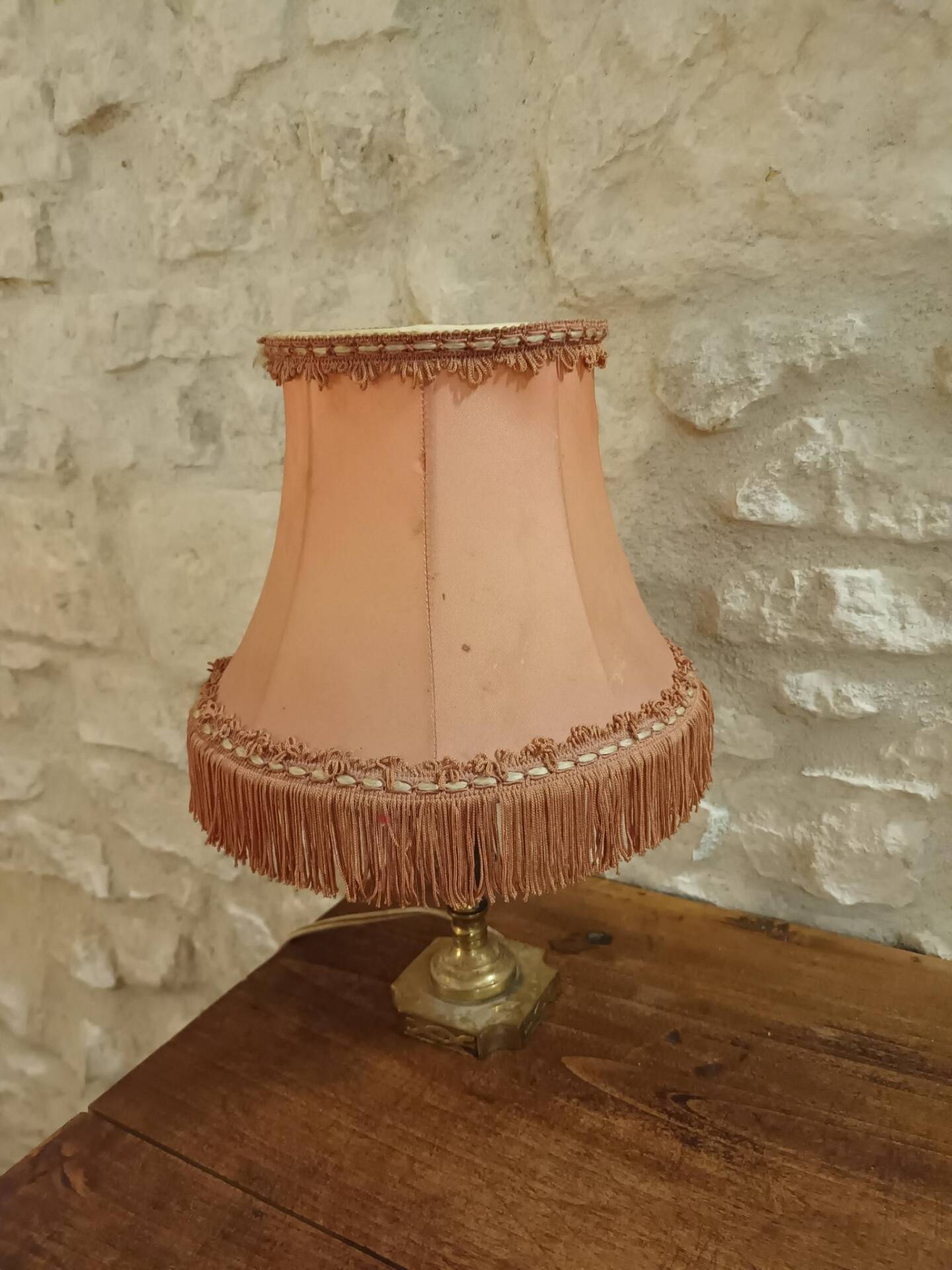 Vintage lamp, pink fringed pagoda shade and brass base.