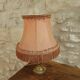Vintage lamp, pink fringed pagoda shade and brass base.