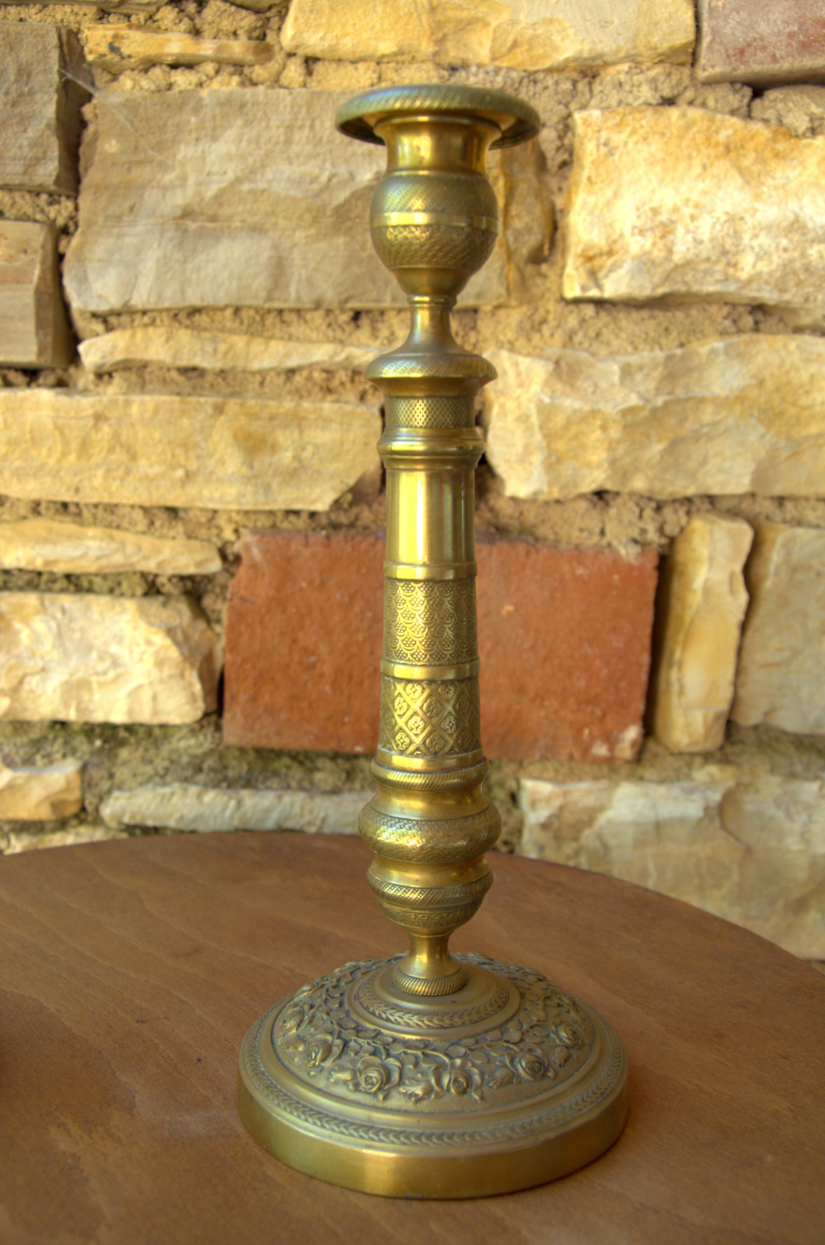 Pair of French neoclassical brass candlesticks, 19th century, 12x29cm