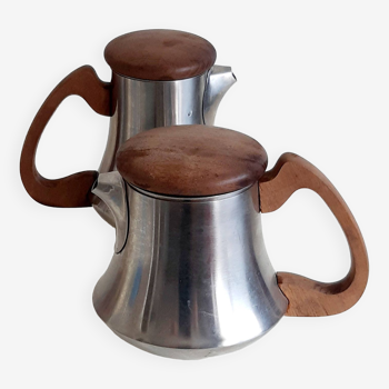 Letang and Remy tea and coffee service in plain stainless steel, exotic wood handles and lids.