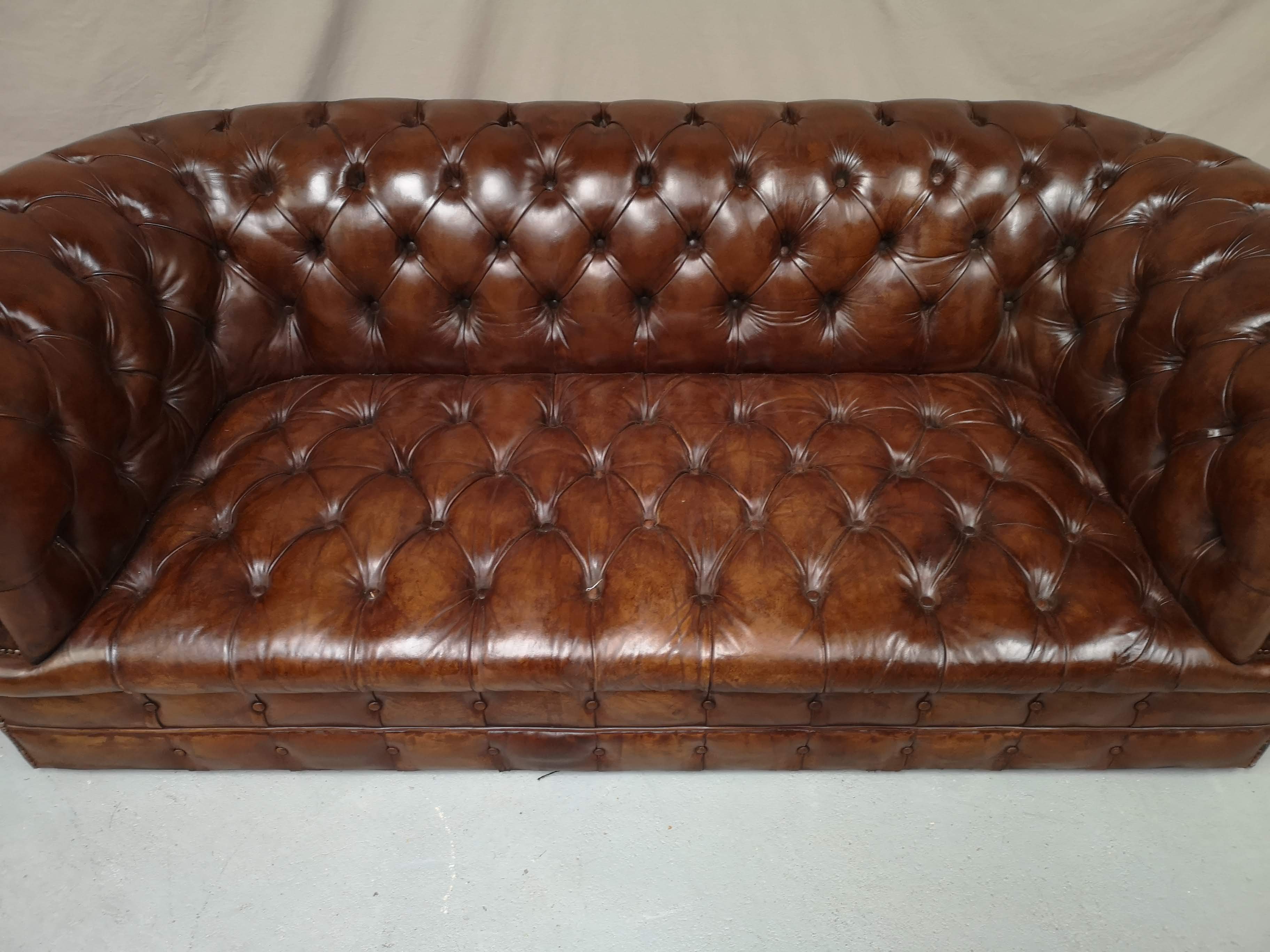 Upholstered chesterfield brown sofa