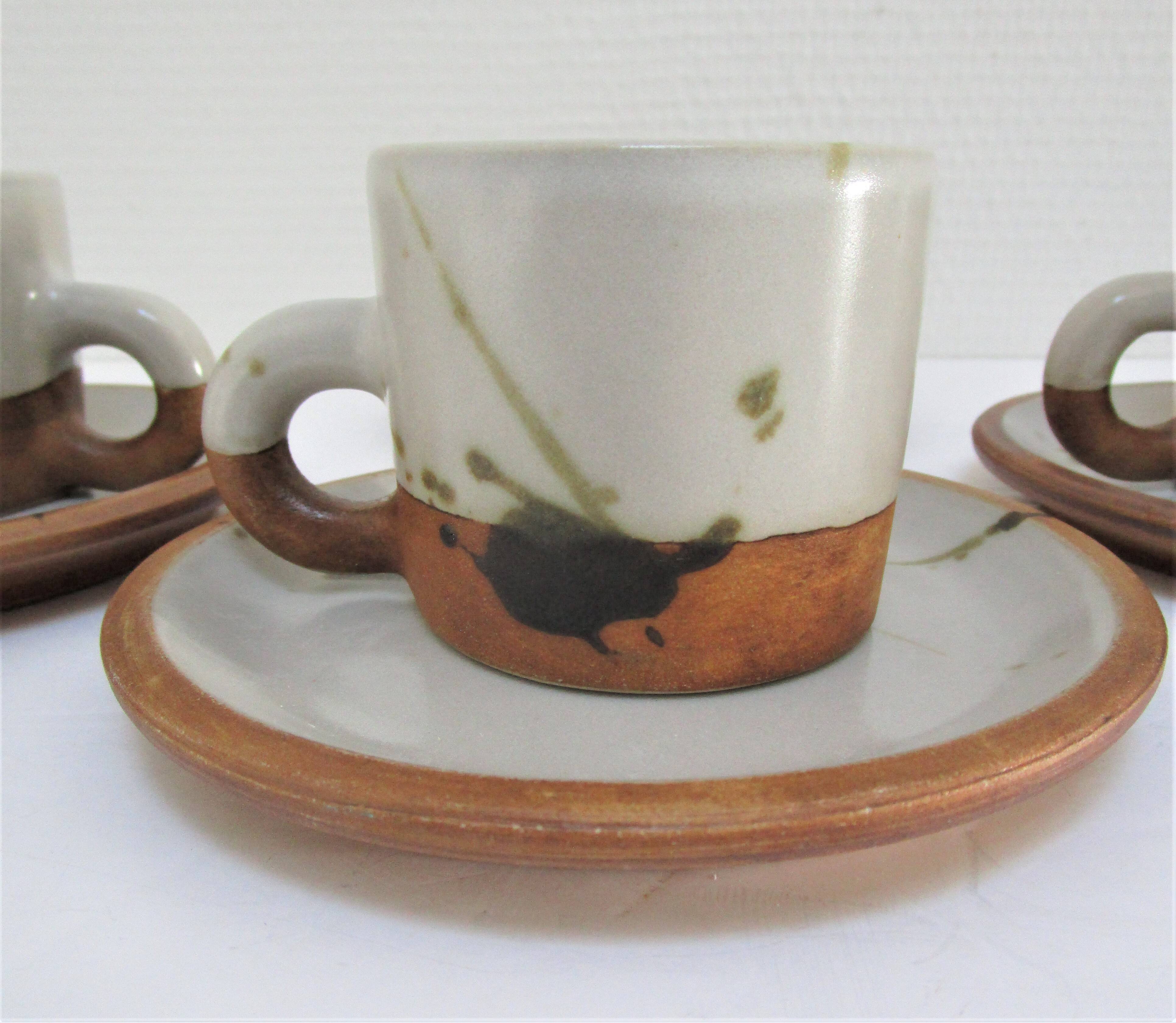 Four pottery cups and saucers from La Colombe Vallauris