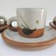 Four pottery cups and saucers from La Colombe Vallauris
