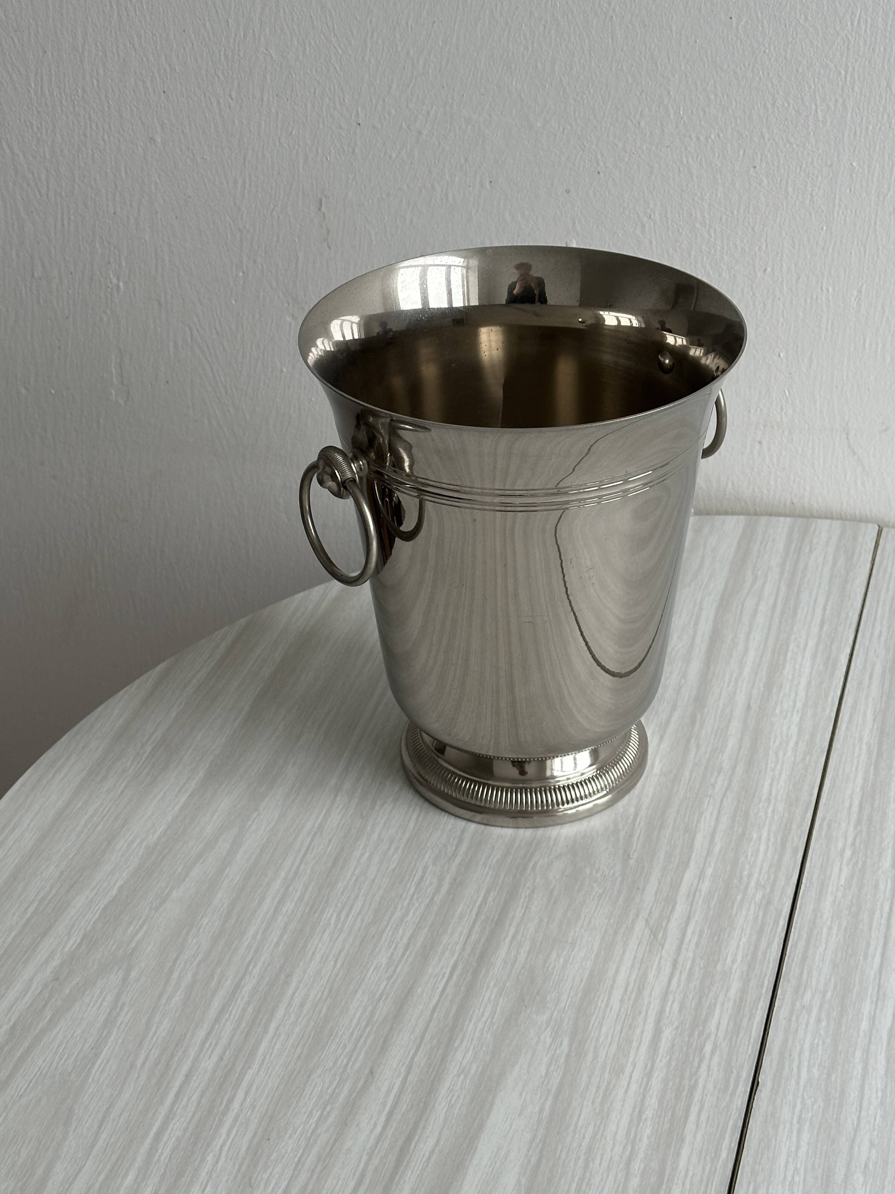 Shiny metal champagne bucket