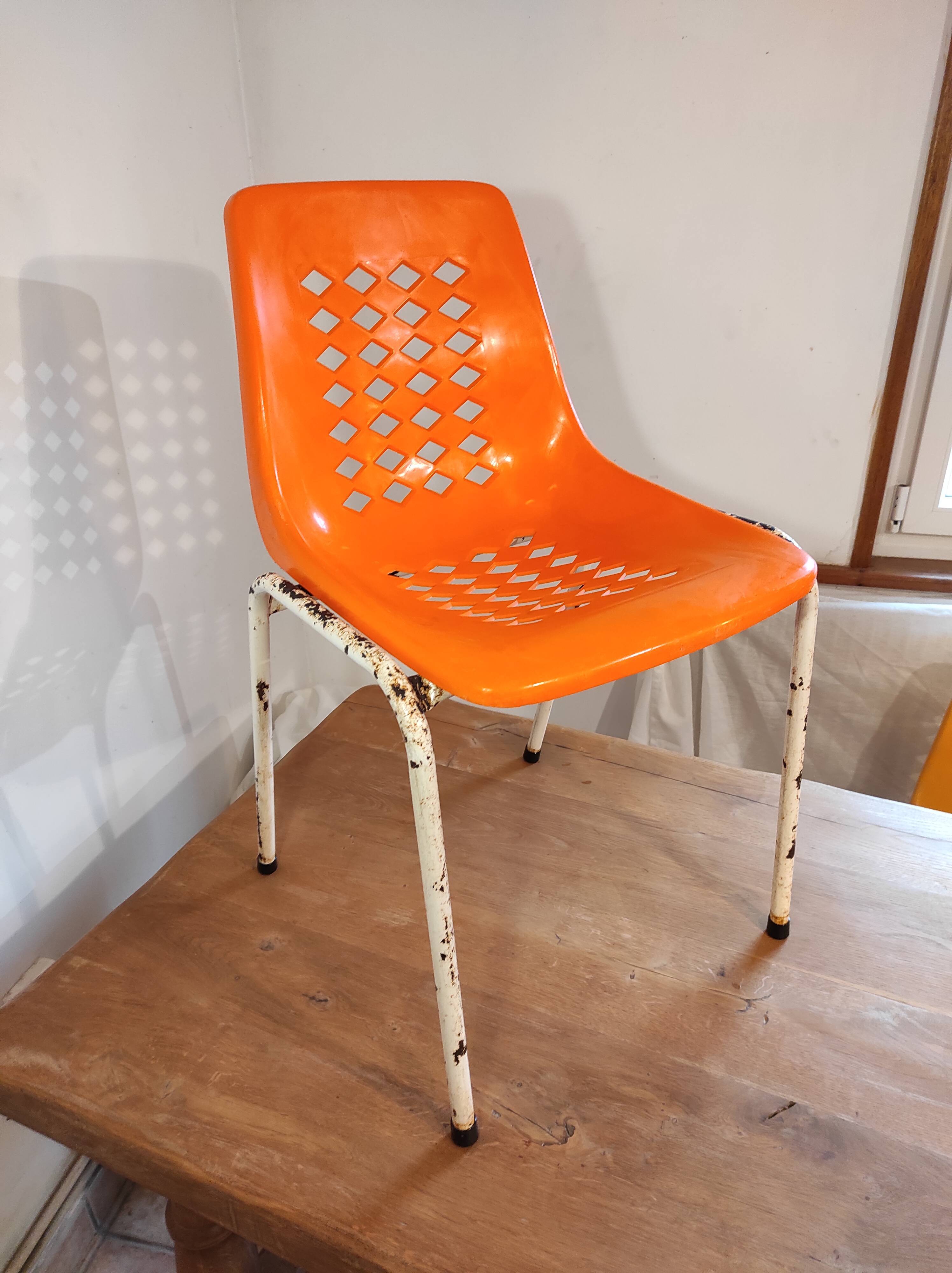 Chair with openwork plastic shell 1970