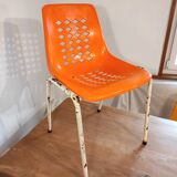 Chair with openwork plastic shell 1970