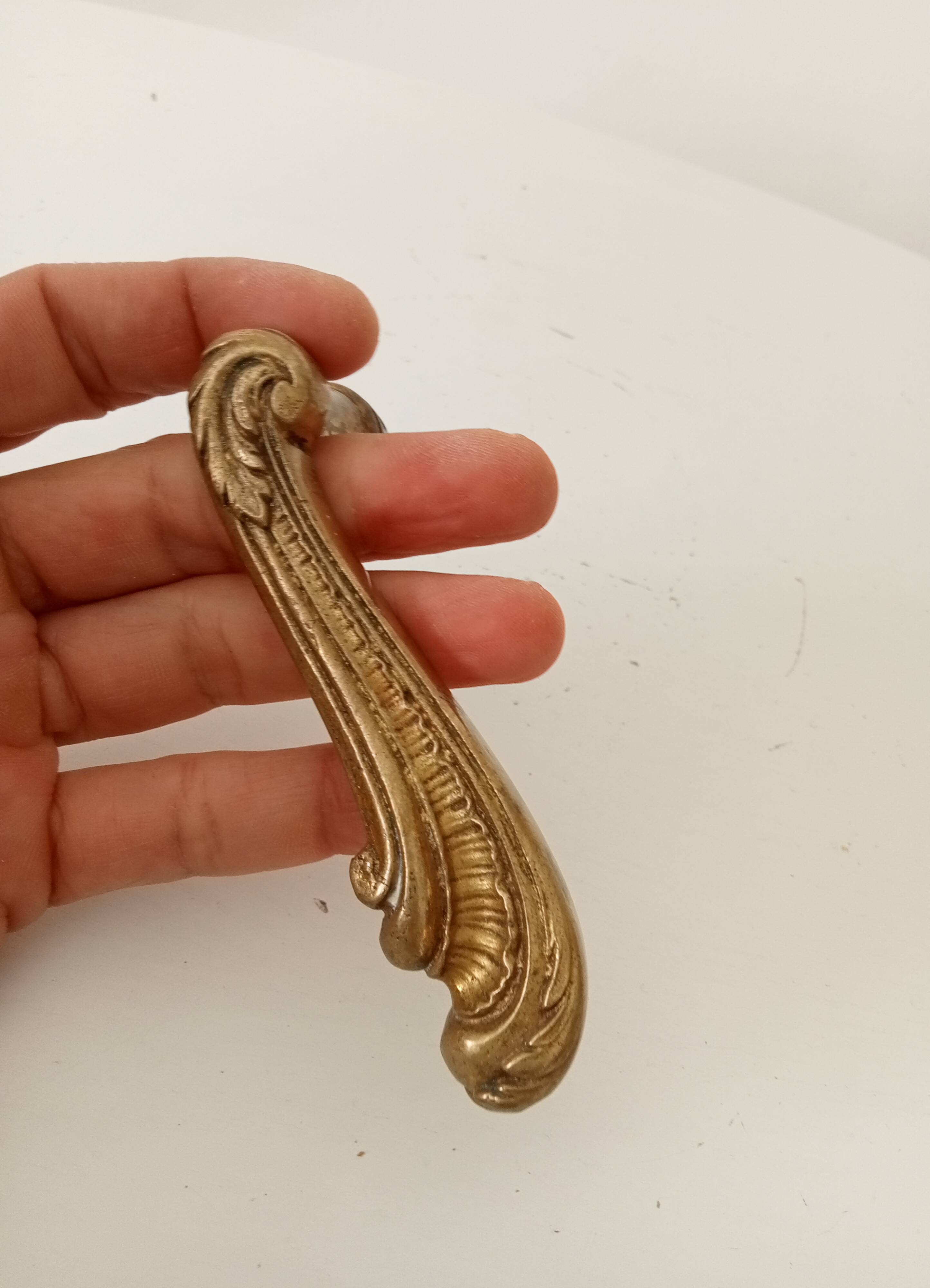 Antique bronze door handle in Empire style