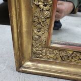 19th century gilt mirror with flowers and foliage decor