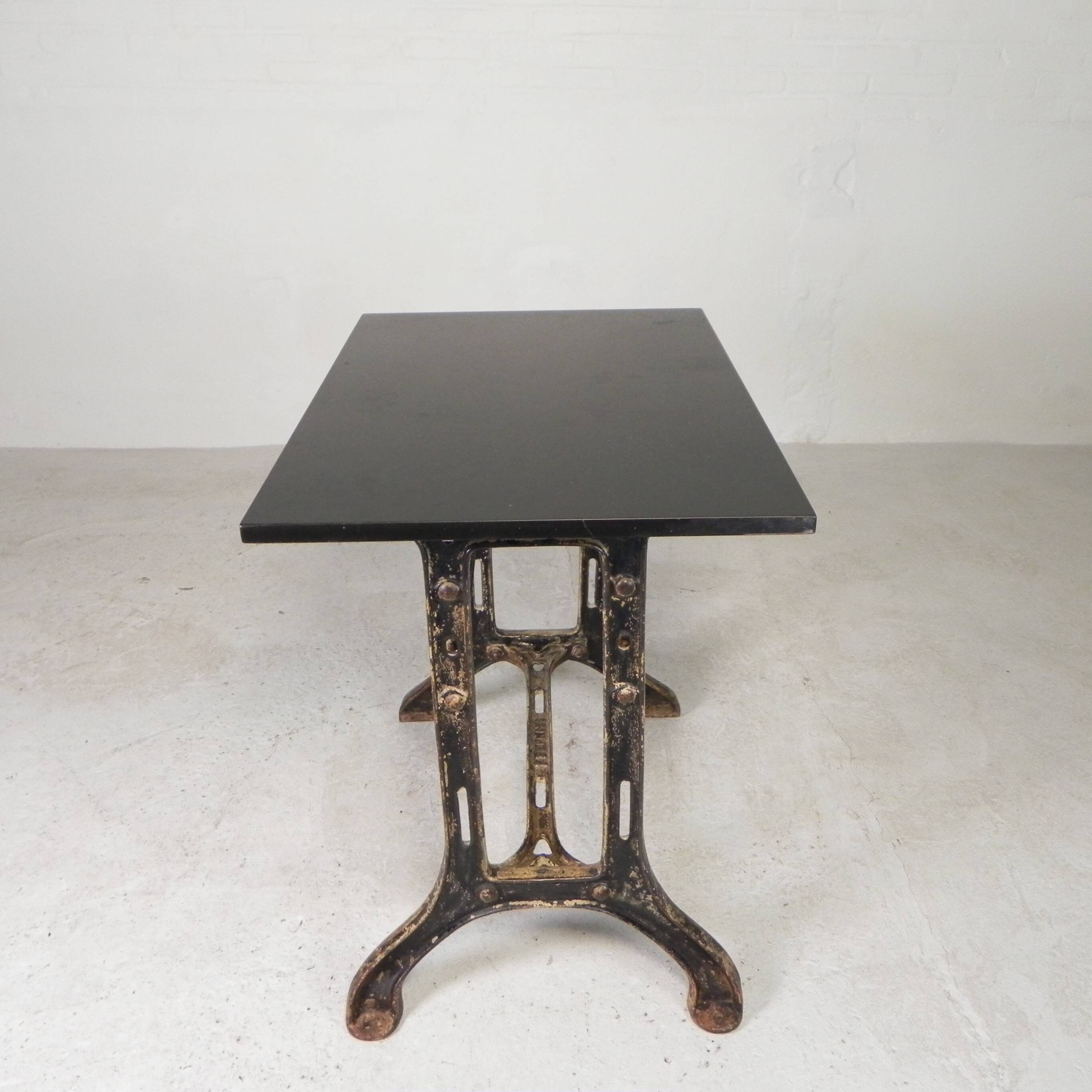 Industrial table, garden table with hard stone slab on cast iron frame, 1930s
