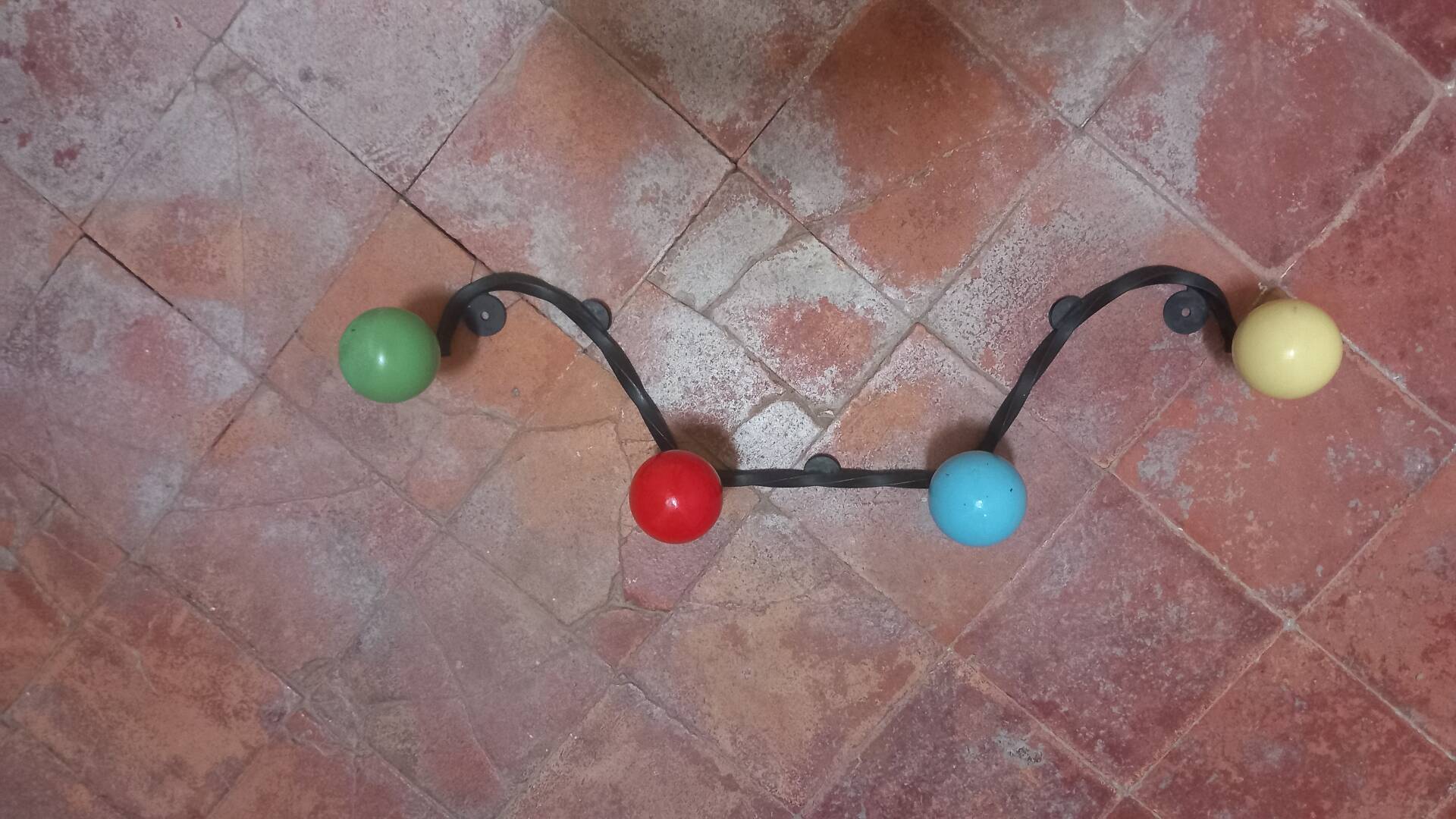 Vintage wall coat rack "Atomic" in wrought iron with multicoloured balls.