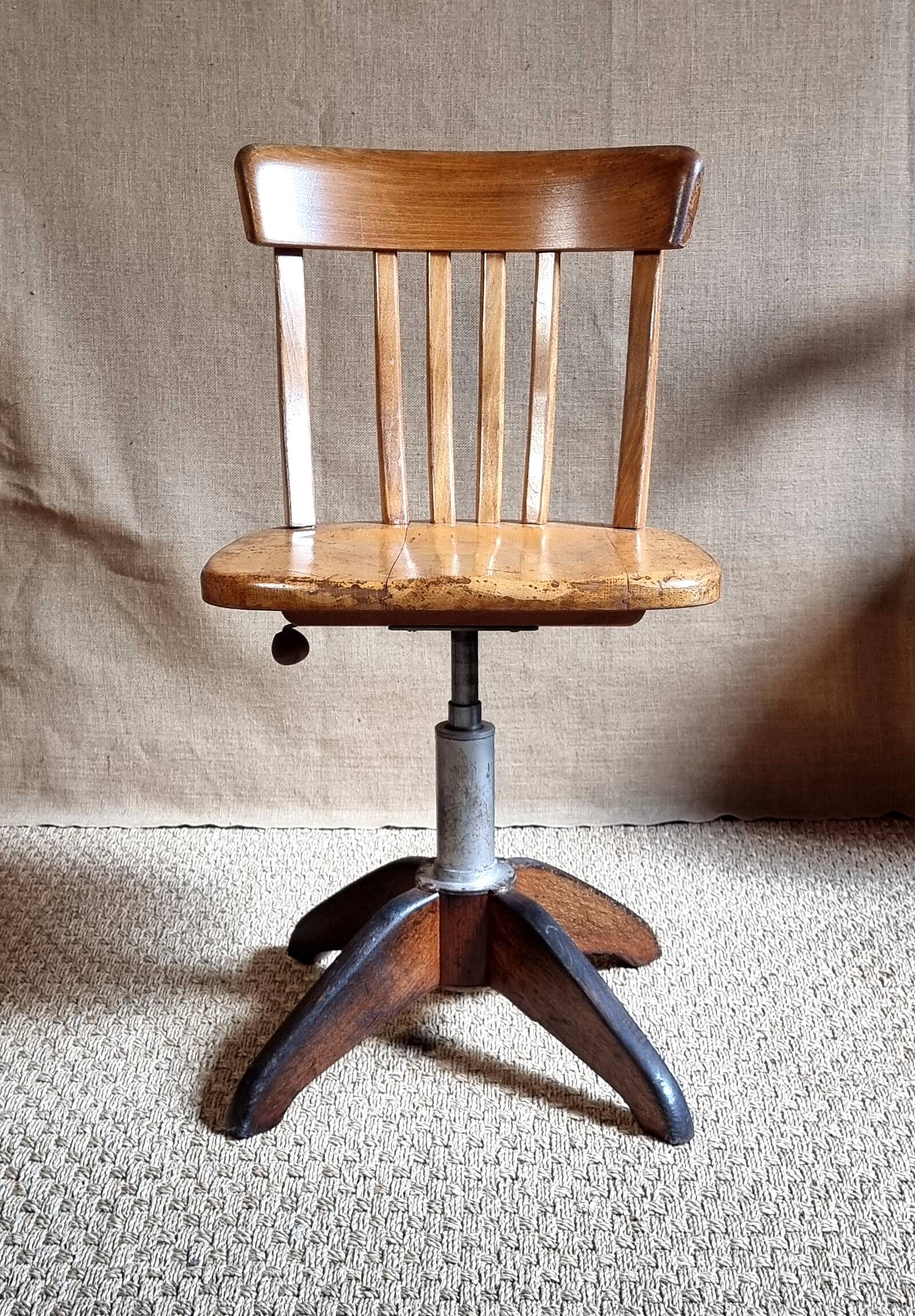 Height-adjustable rotating workshop office chair