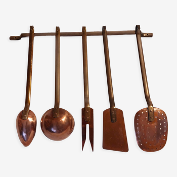 Vintage copper and brass kitchen utensils.