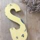 Vintage yellow sign letter S