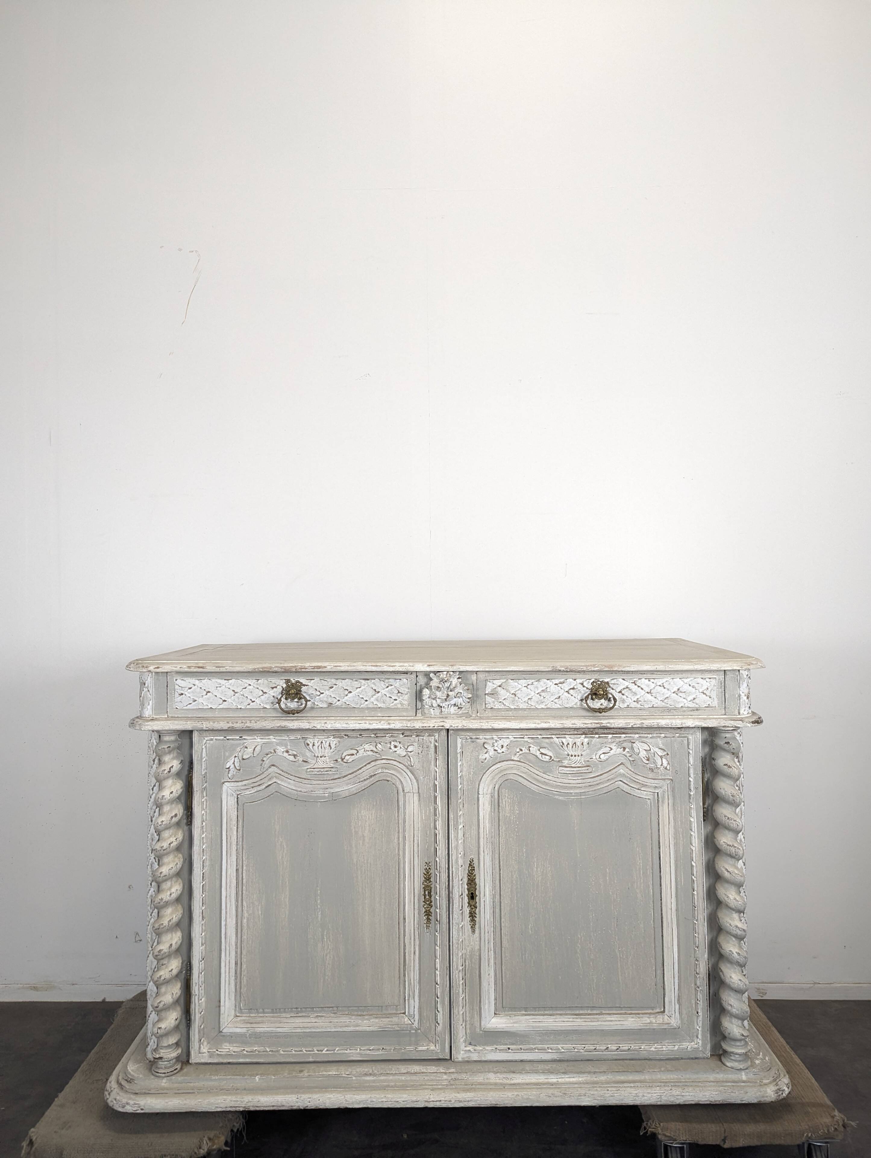 Louis XIII buffet with twisted column in grey patinated oak, two doors, two drawers.