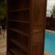 Chic old bookcase pegged in walnut with two glass doors and 5 shelves – Very good condition