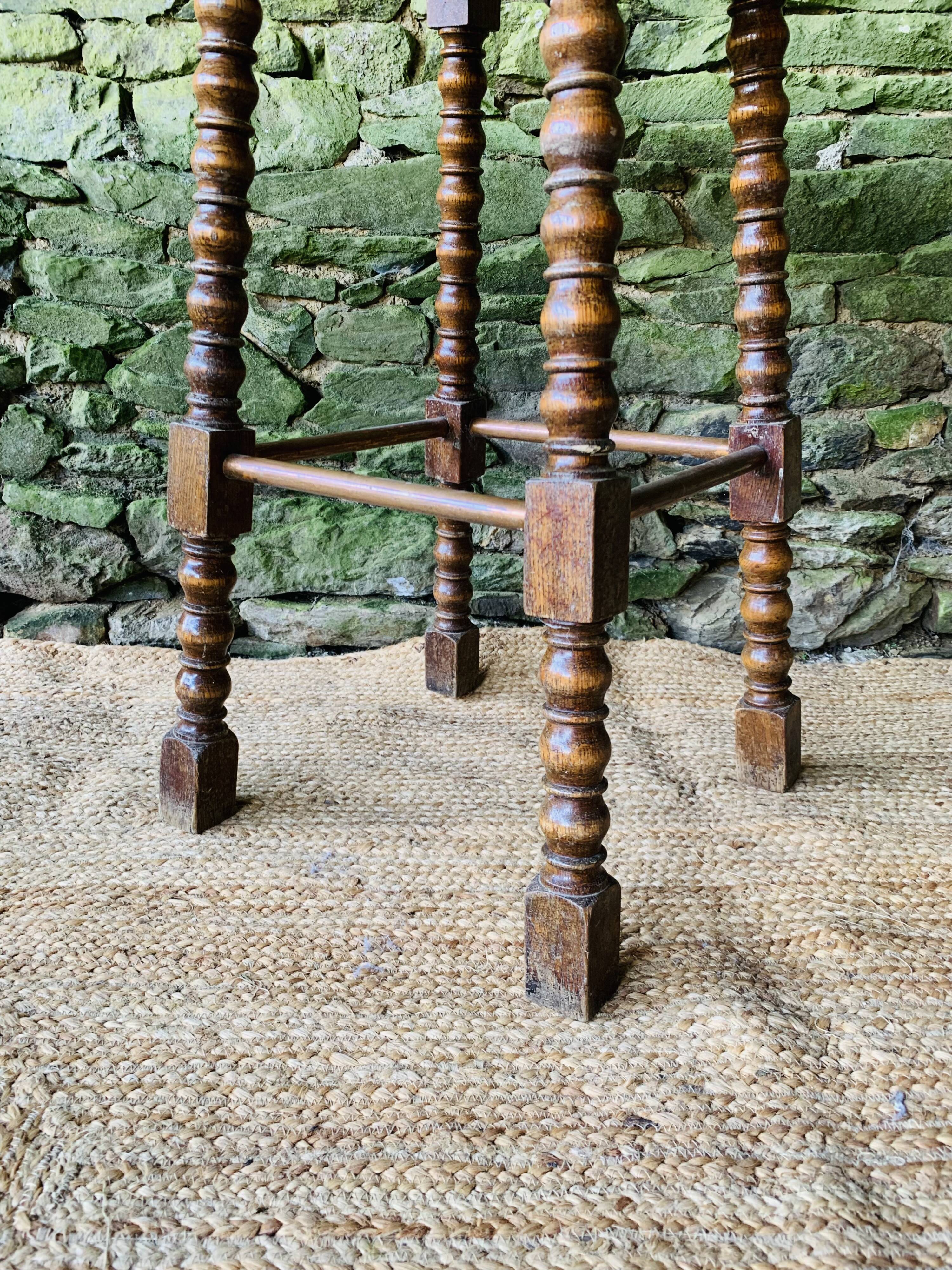 High stool in turned wood