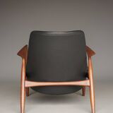 Fauteuil Seal en cuir et teck Ib Kofod-Larsen pour OPE, Suède, années 1960.
