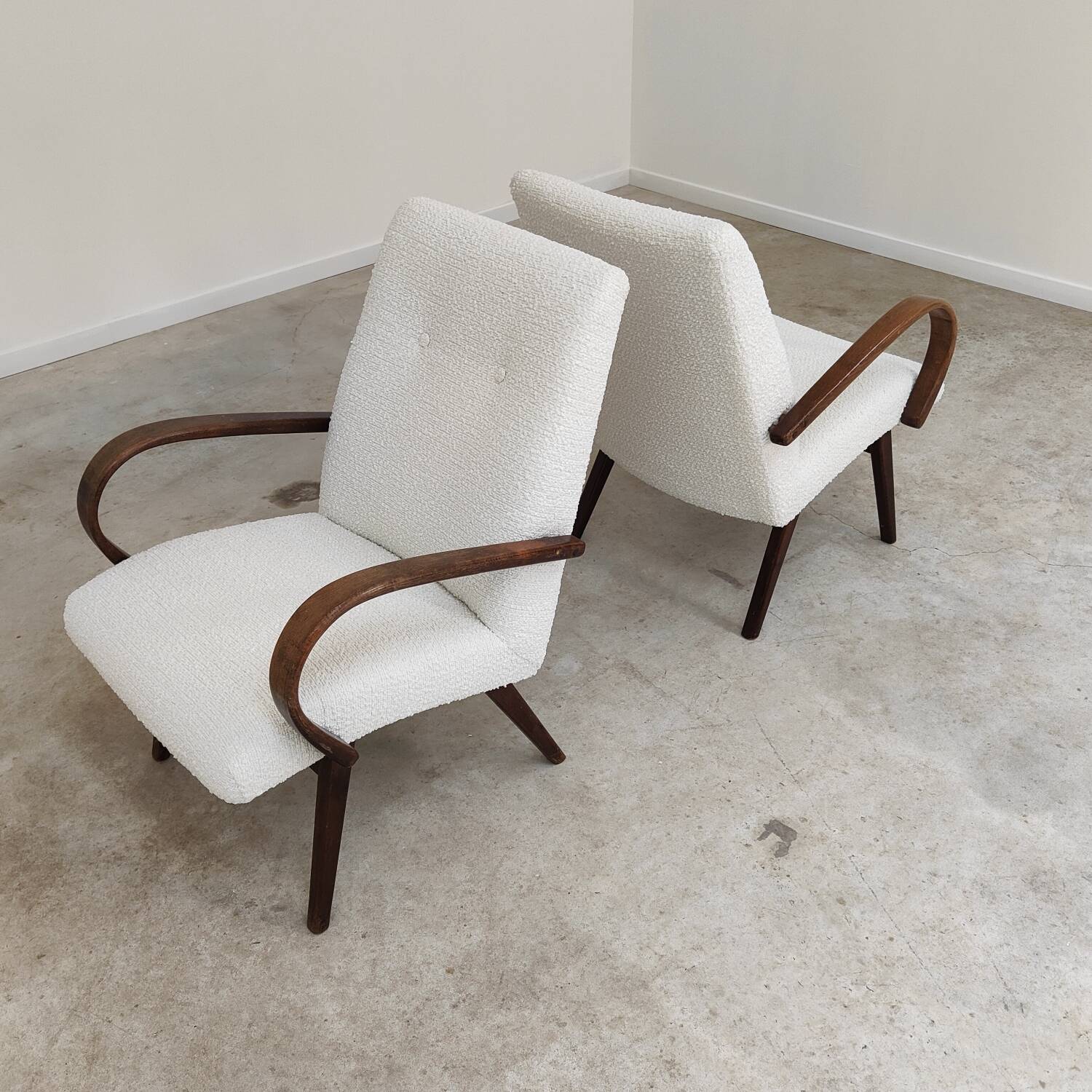 Pair of Jaroslav Smidek armchairs for Ton Bystrice, restored with white boucle, 1960.