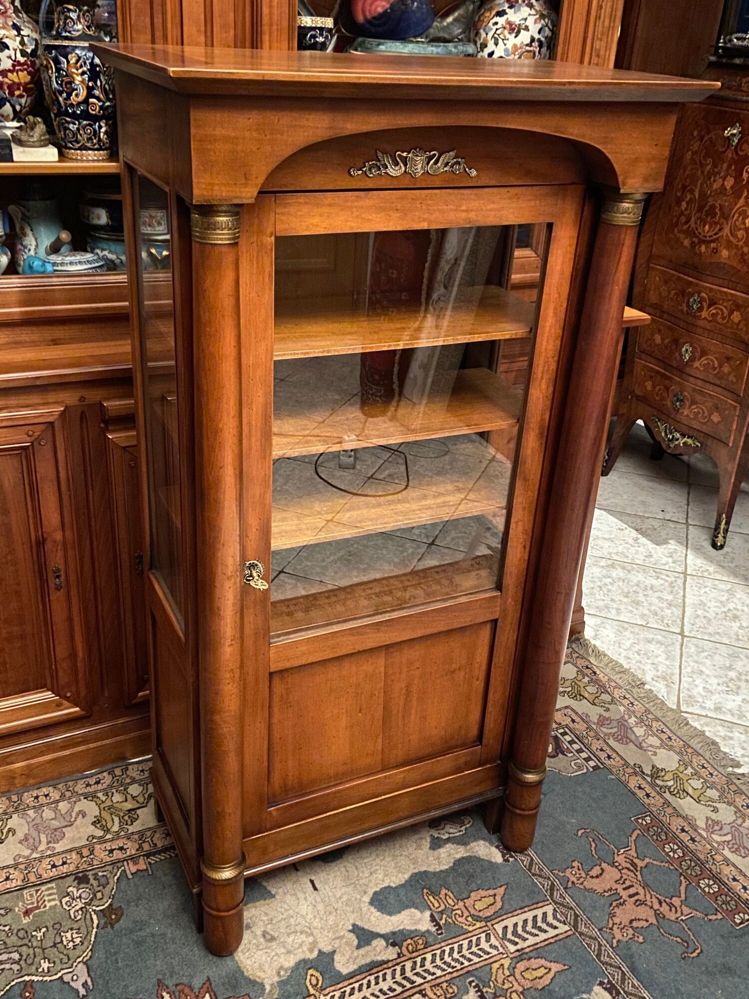 Empire style display case in cherry wood