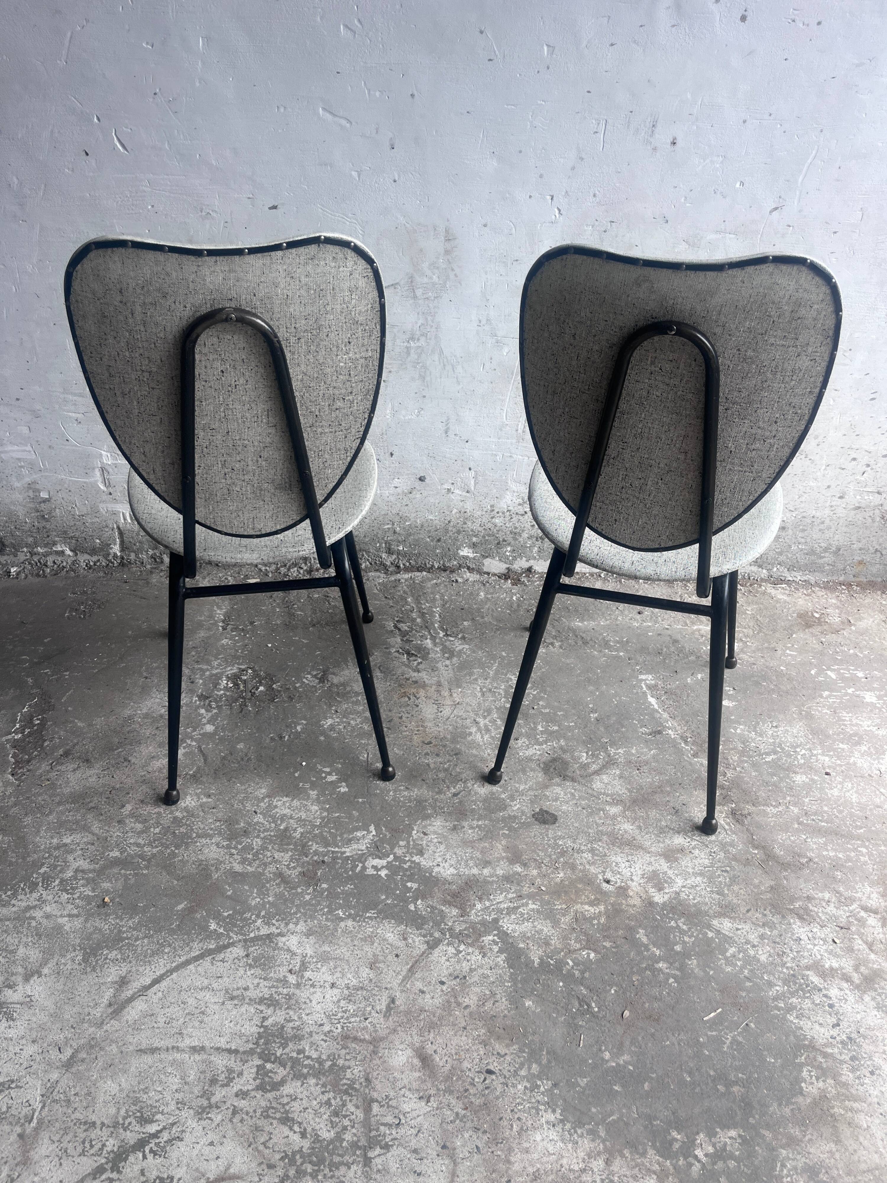 Elegant pair of French dining chairs by Jacques Hitier from the 1950s.