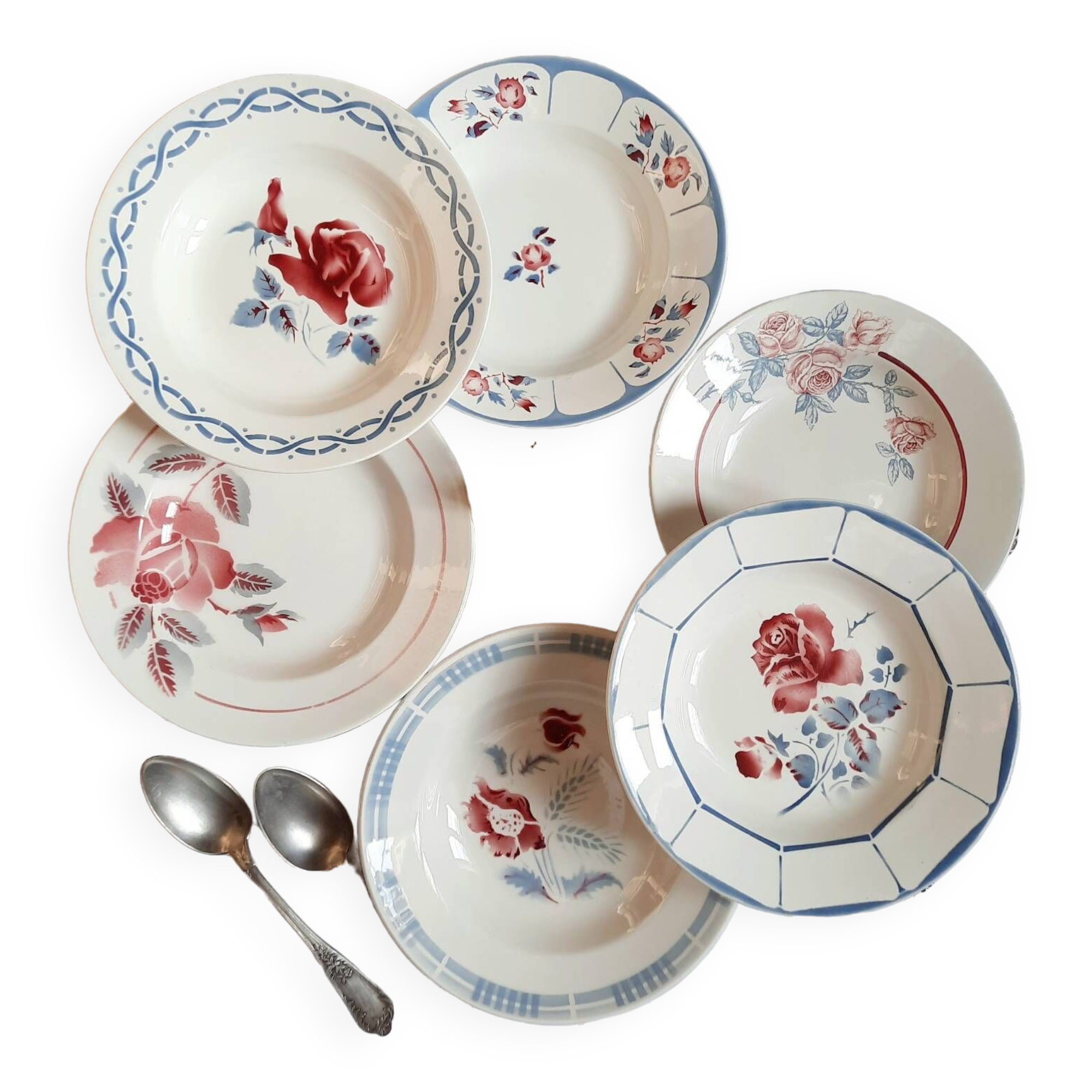 Mismatched old soup plates accompanied by a soup tureen