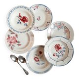 Mismatched old soup plates accompanied by a soup tureen