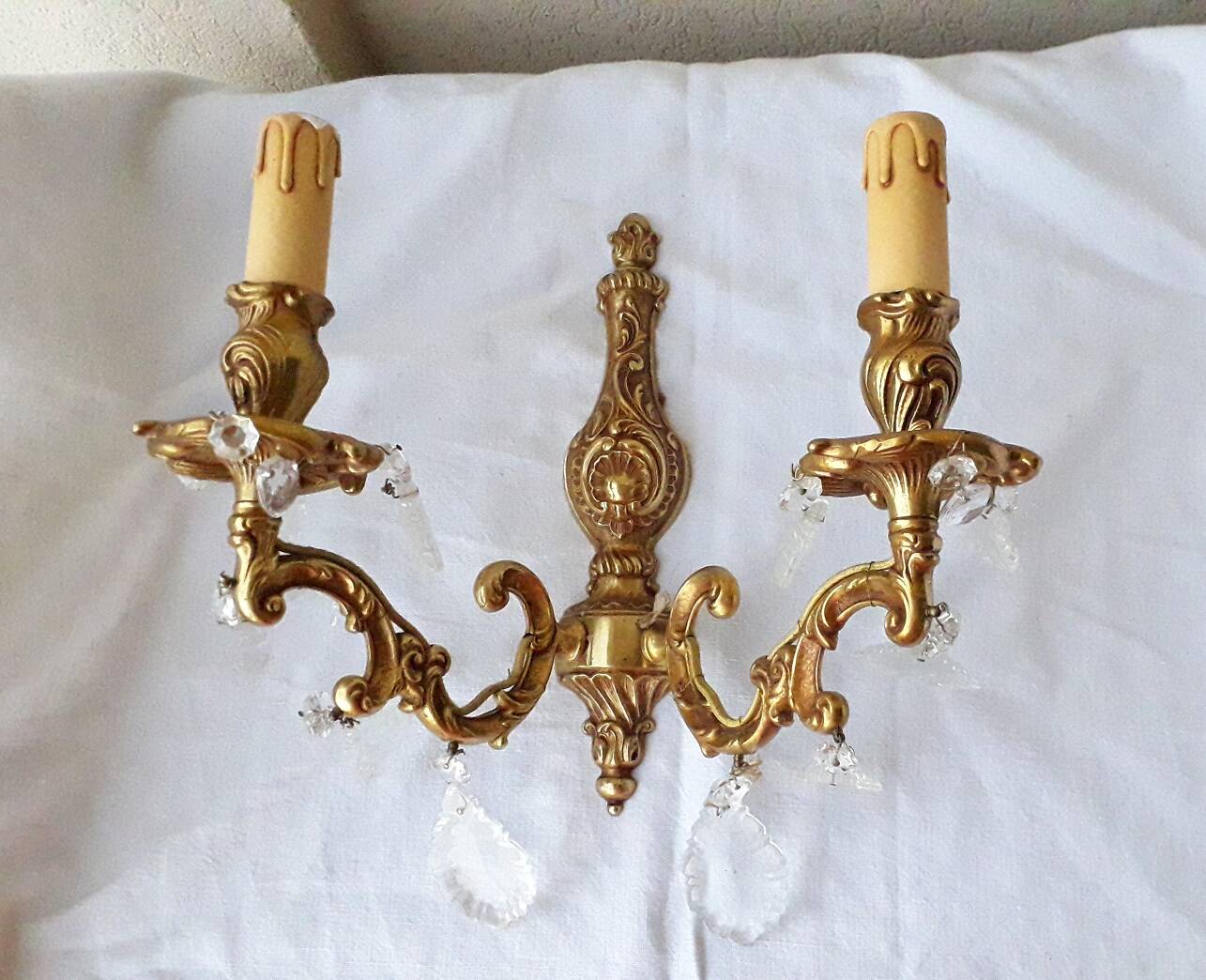 pair of bronze wall lights with pendants