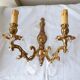 pair of bronze wall lights with pendants