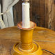 Candle holder-style lamp made entirely of ceramic.