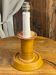 Candle holder-style lamp made entirely of ceramic.