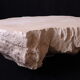 Designer coffee table with travertine rock effect — unique handcrafted piece.
