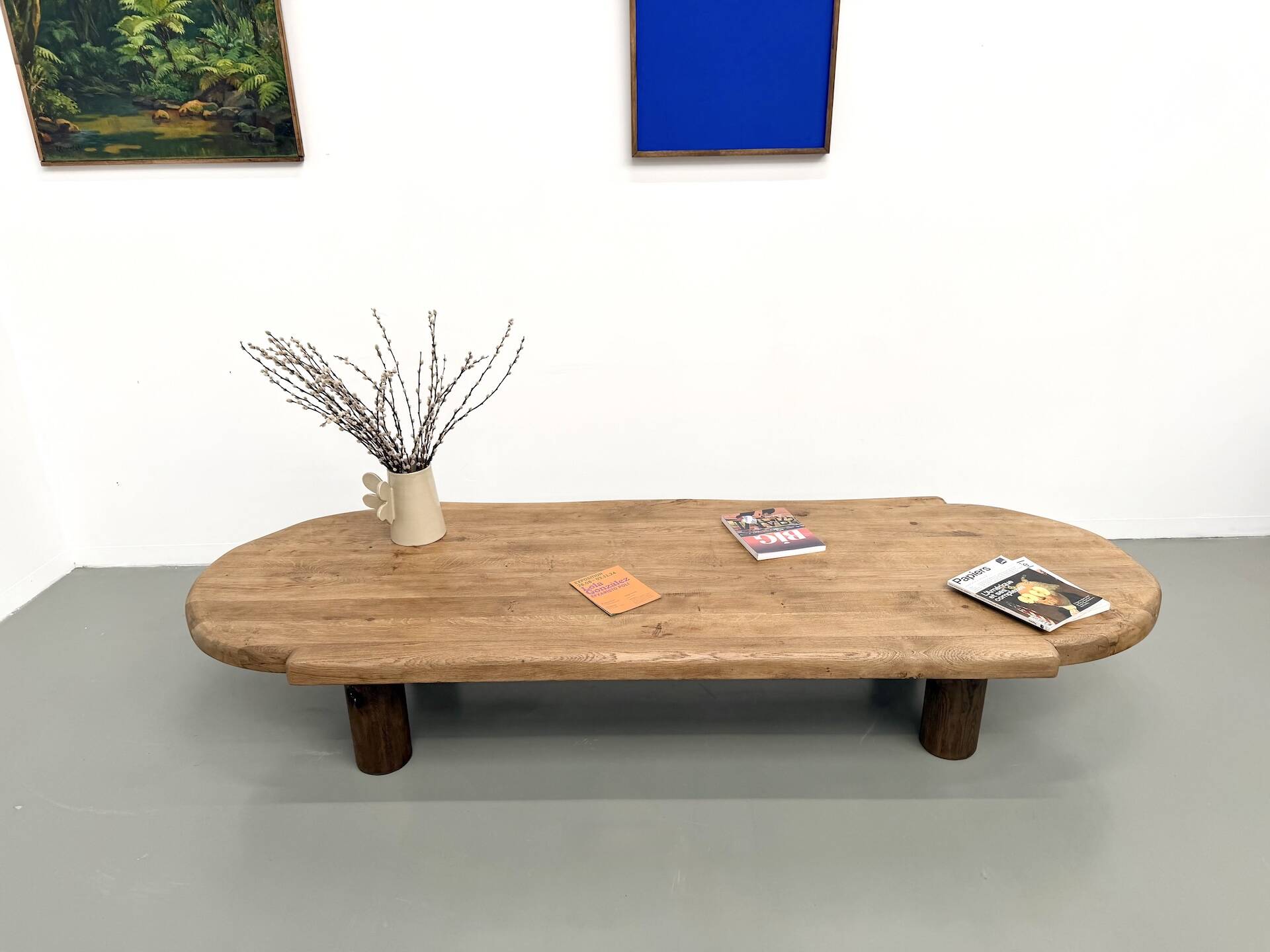 XXL oval coffee table in solid oak, cylindrical base, 1950s.