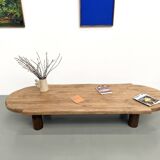 XXL oval coffee table in solid oak, cylindrical base, 1950s.