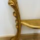 Golden console in Louis XV Rococo style made of resin.