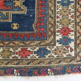 Antique tissé à la main - Tapis persan à fond bleu avec des figures ressemblant à des oiseaux
