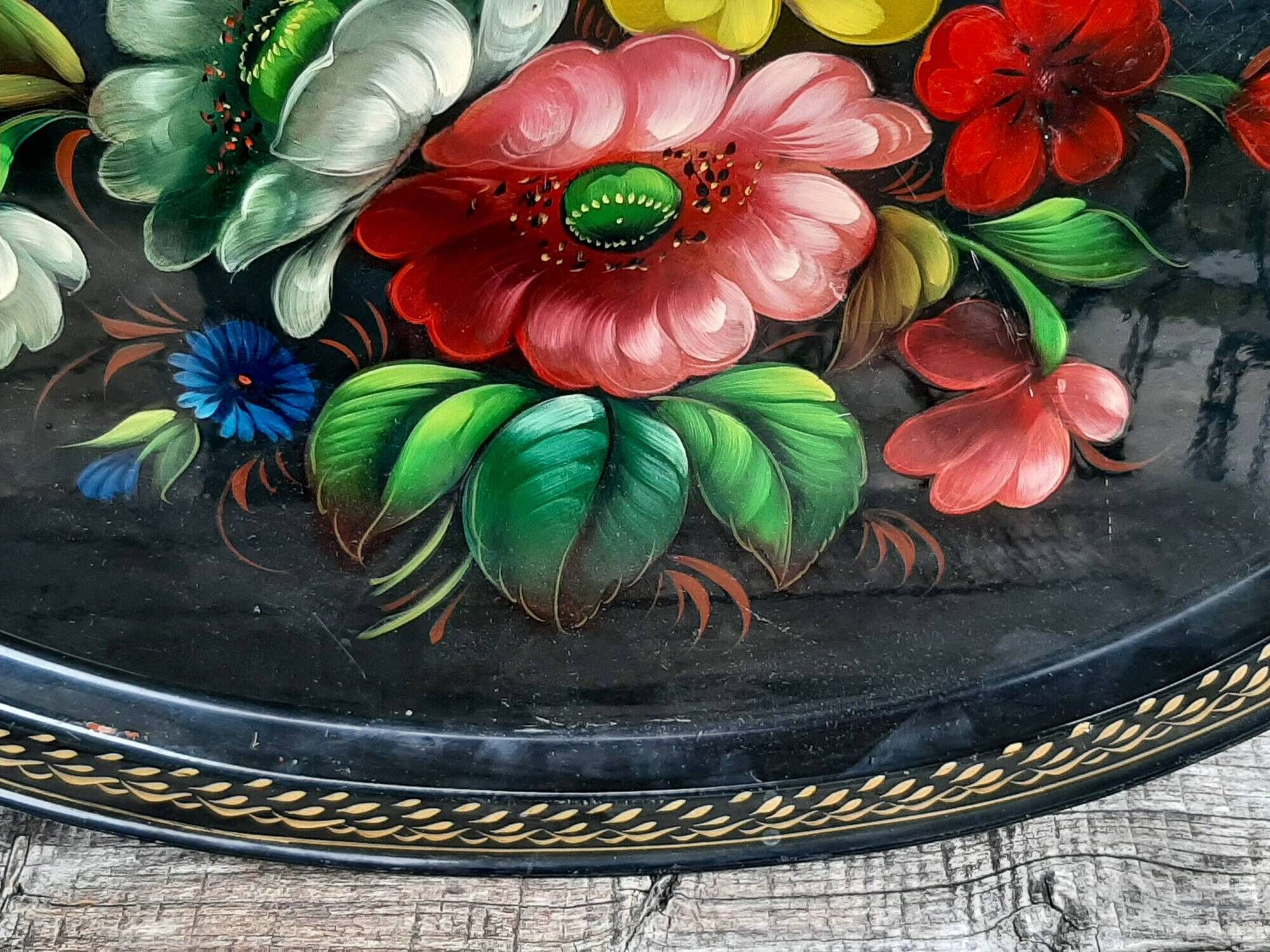 Black lacquered metal tray with multicoloured vintage Russian floral decoration.