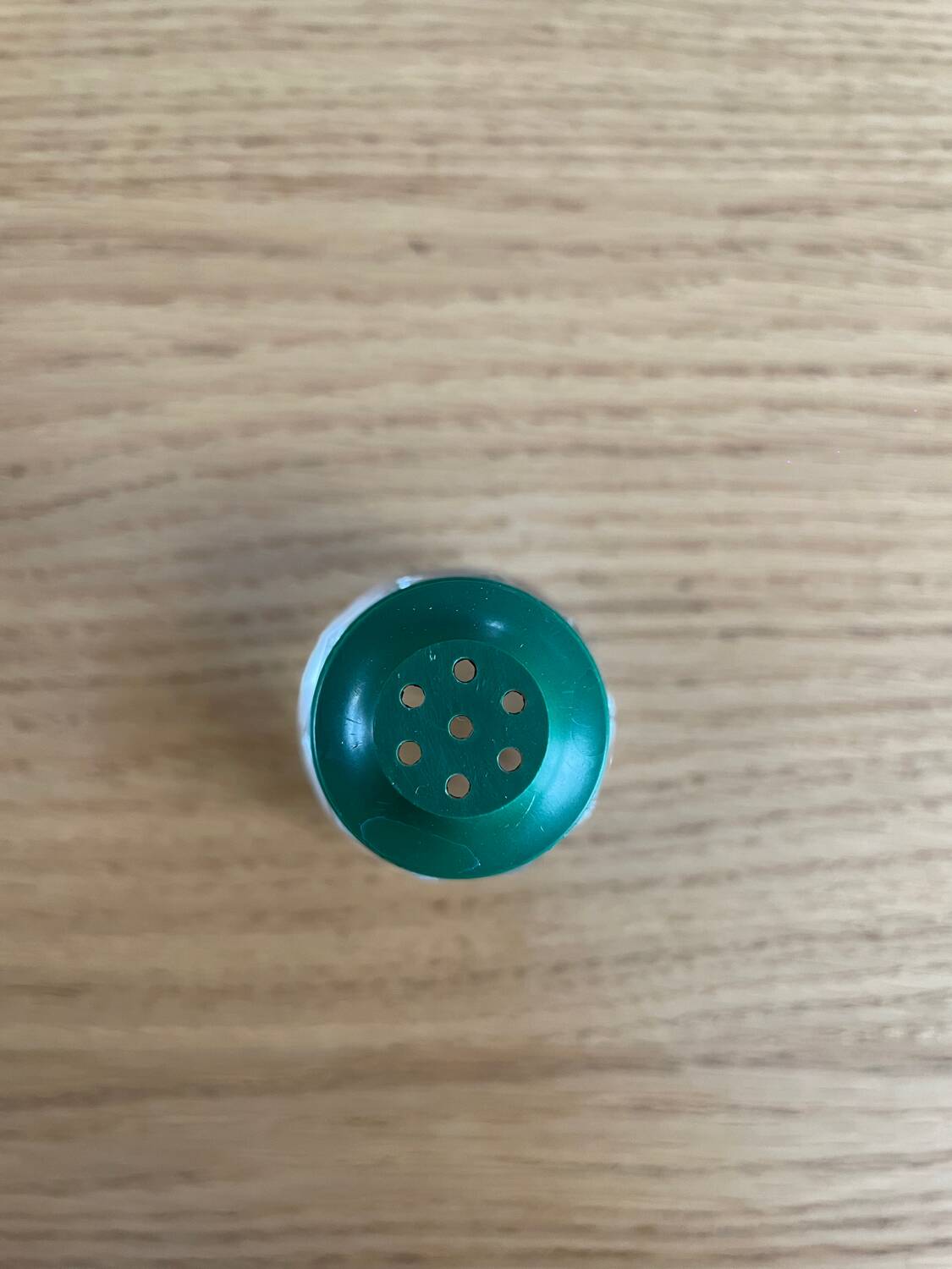 Vintage salt shaker with green Bakelite cap