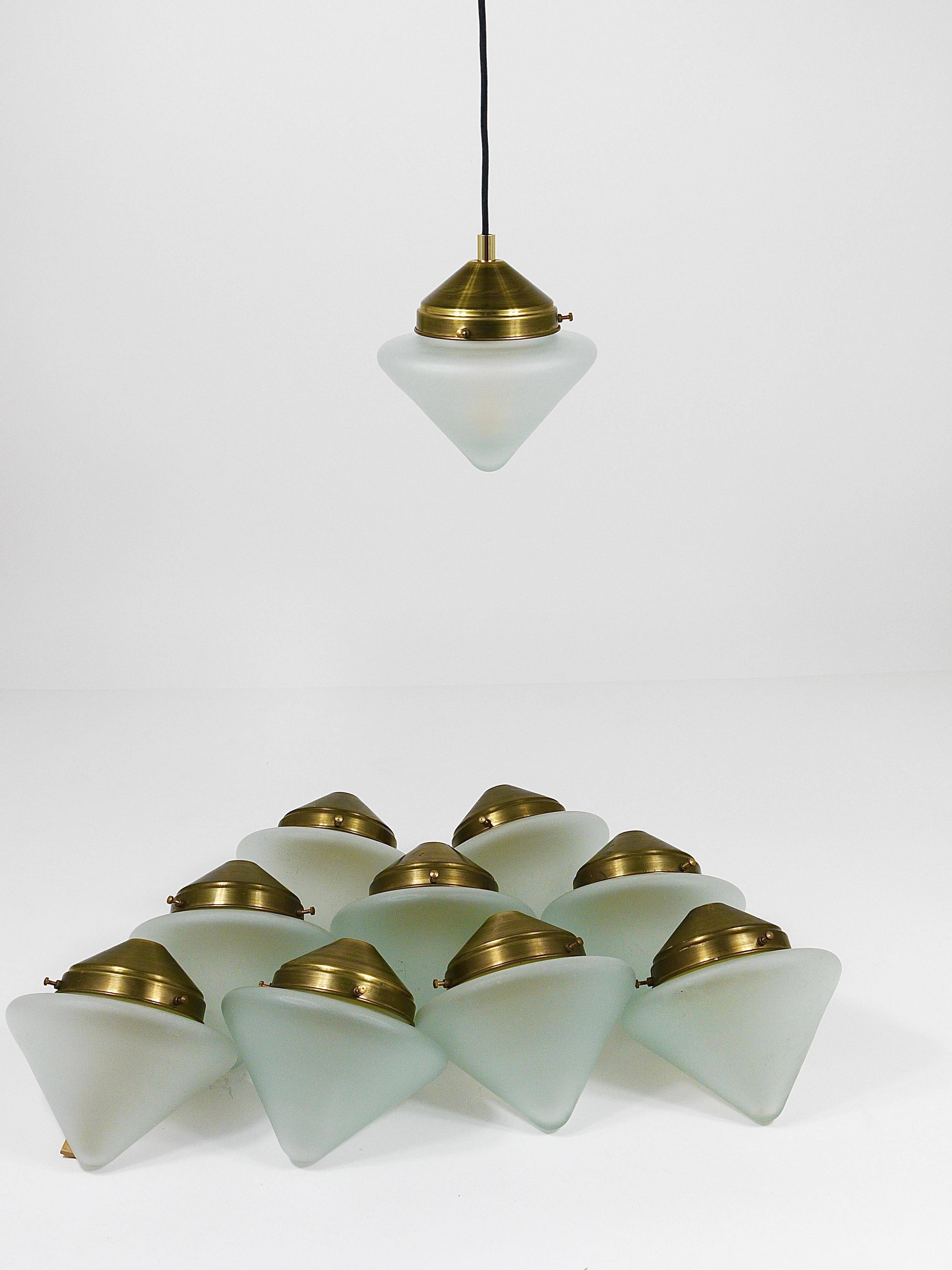 Up to 7 Art Deco brass pendant lights with conical glass shades, Vienna 1930s.