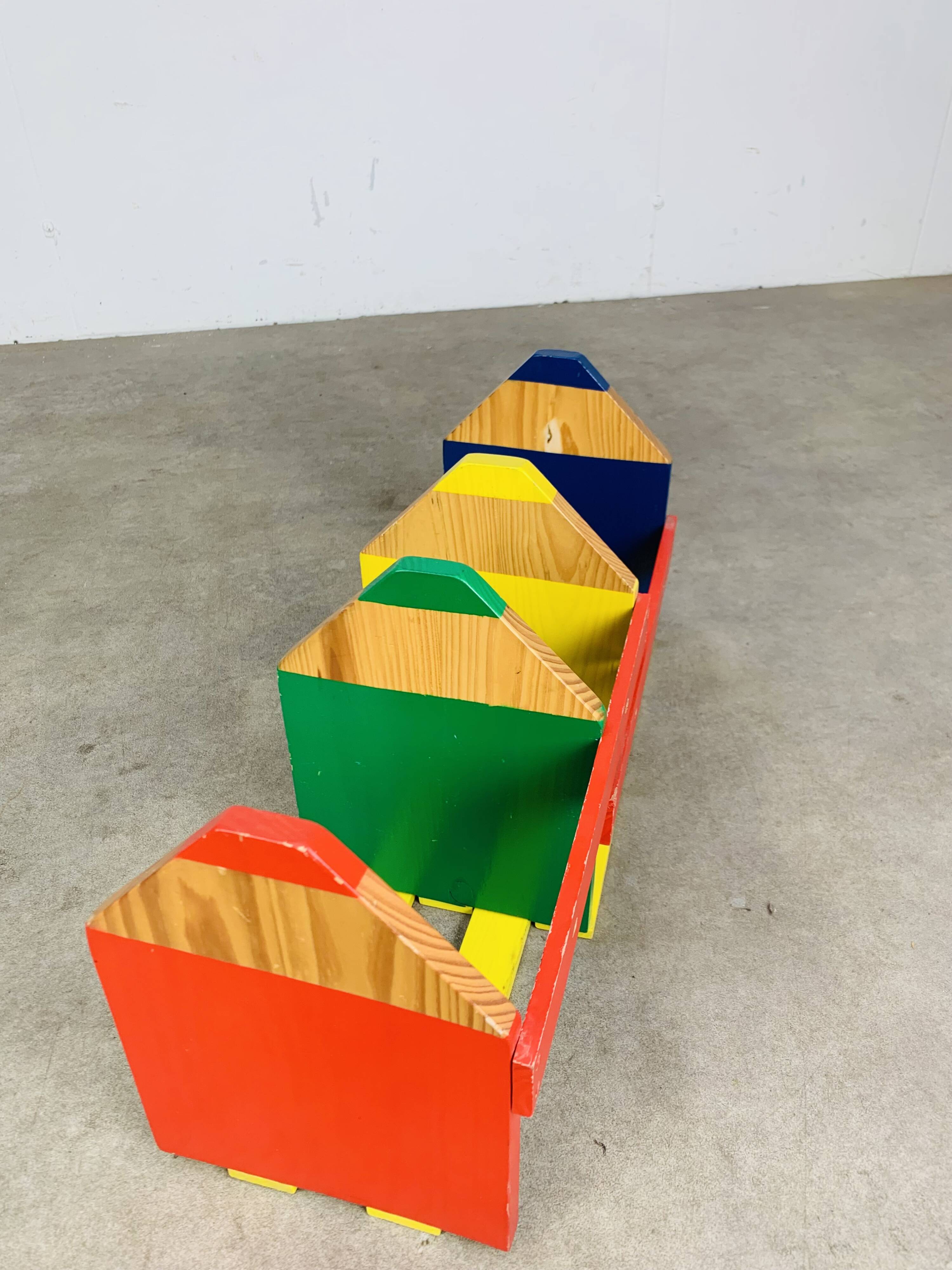Modular wall-mounted pencil shelf in Pierre Sala style, for children.