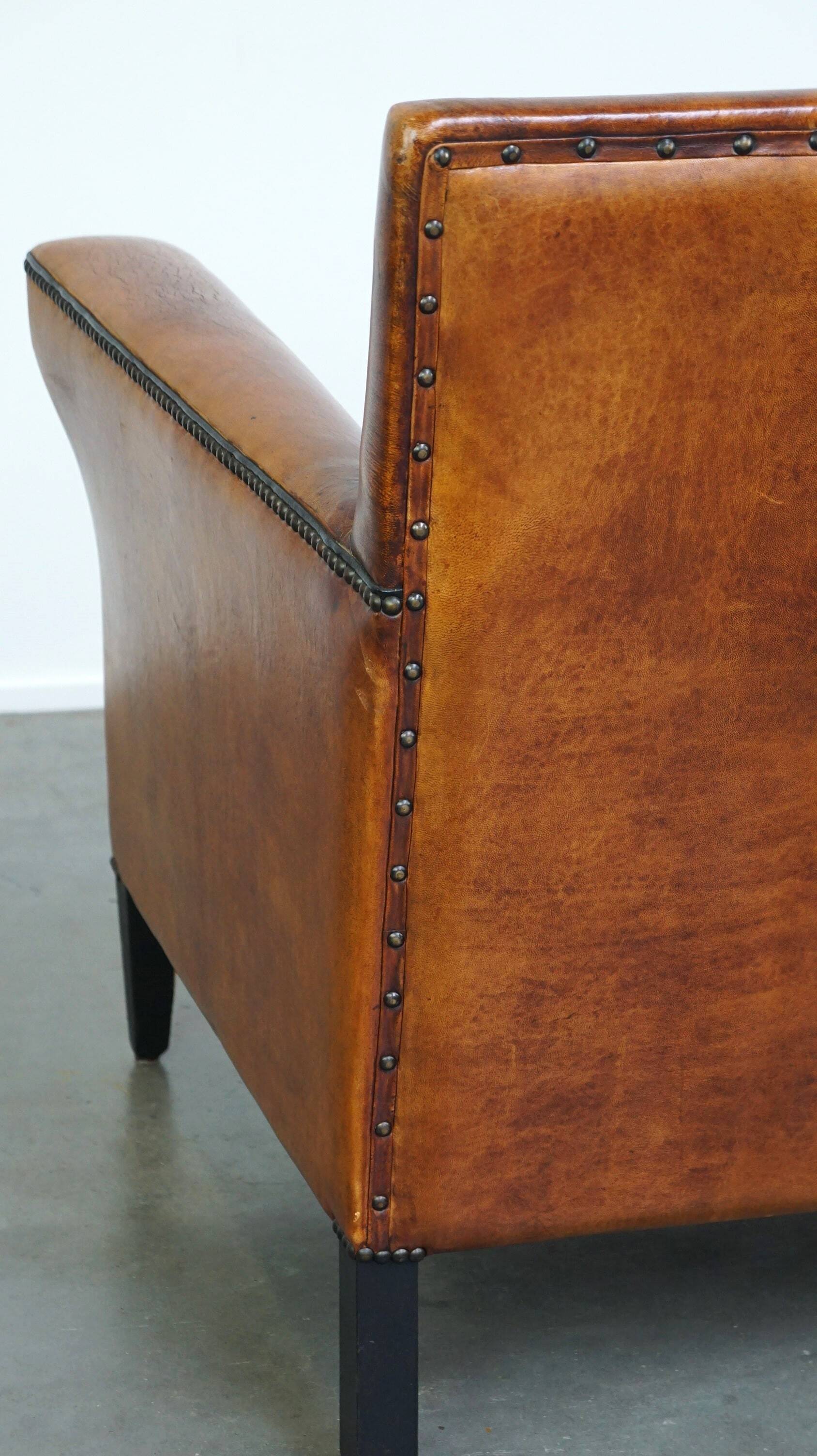 Sleek sheepskin Art Deco design armchair with beautiful details