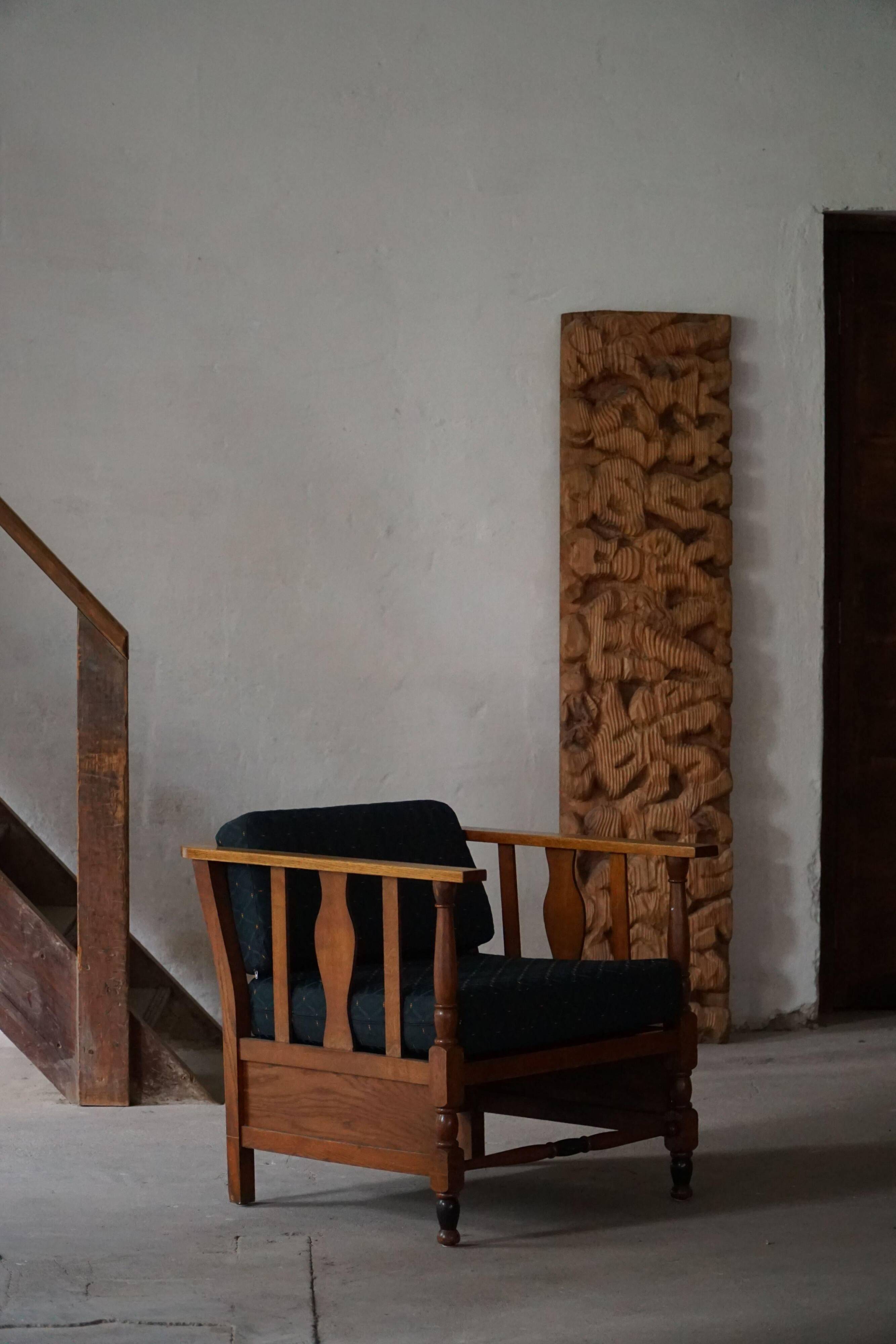 Art Nouveau, pair of oak lounge chairs, reupholstered in style fabric, 1920s.