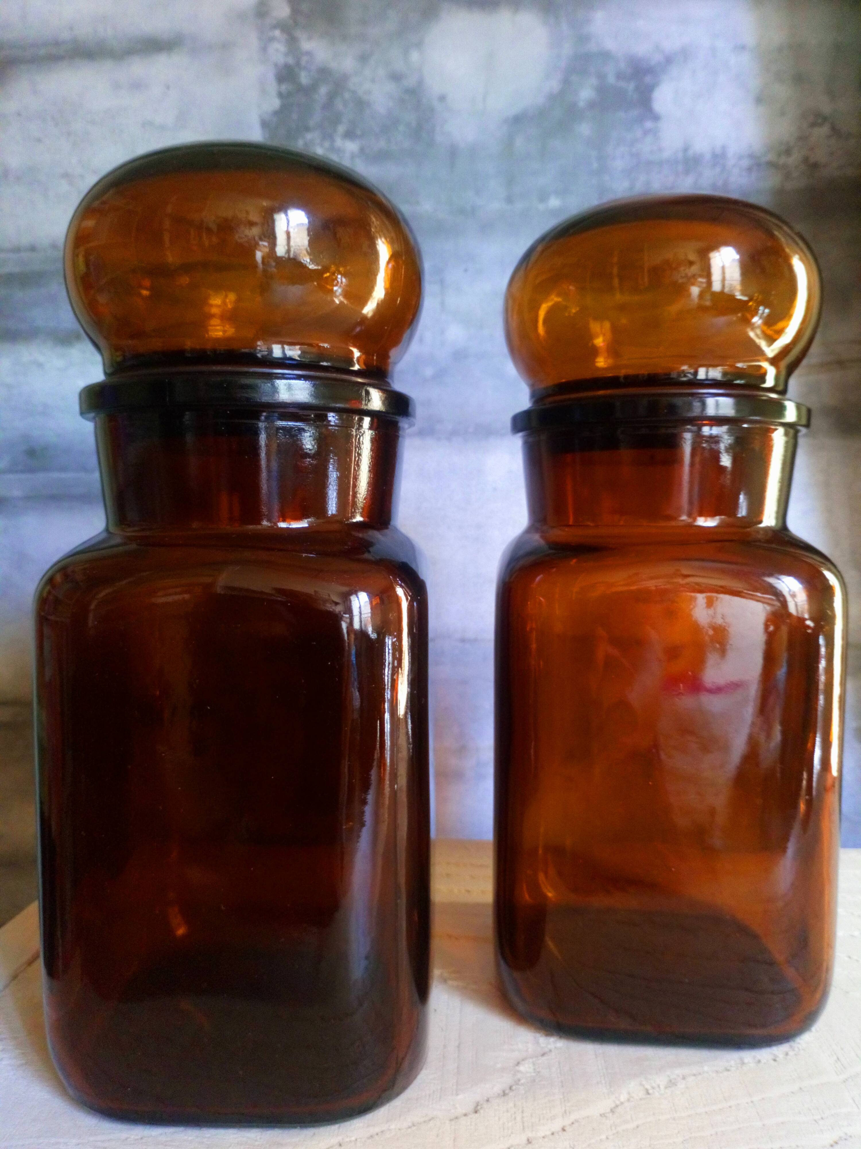 Duo of vintage apothecary bottles in amber glass