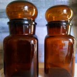Duo of vintage apothecary bottles in amber glass