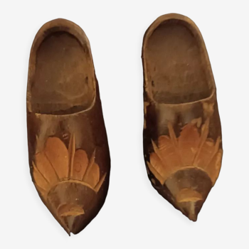 2 carved wooden clogs