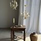 Small vintage cream metal flower chandelier with orange flowers and 3 arms.