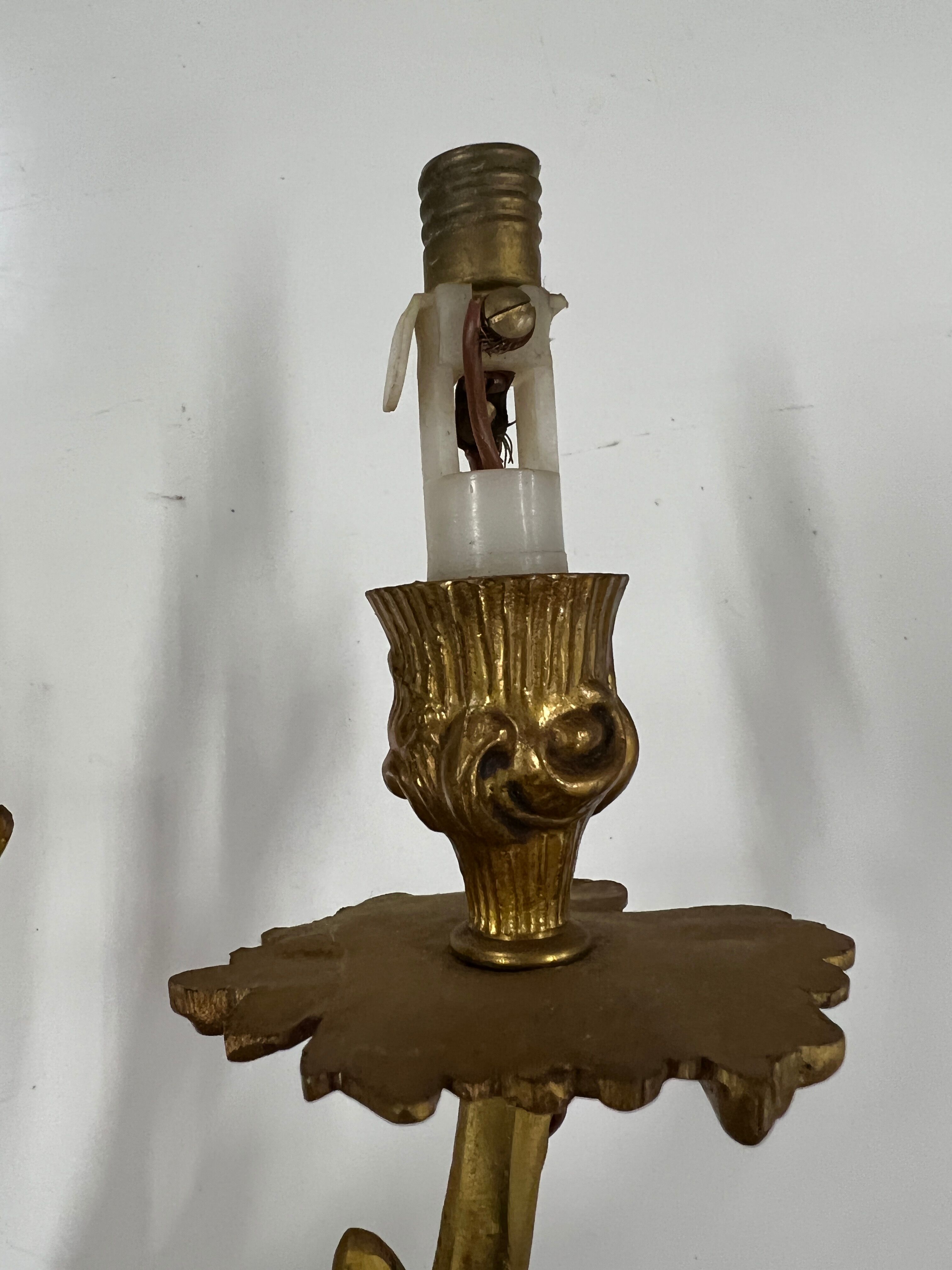 Pair of Louis XV wall lamps in gilded bronze